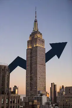 stock arrow behind empire start building representing economics