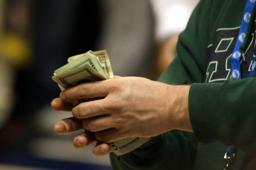 'Freedom Dividend'- man holding money