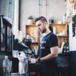 New York City minimum wage employee in a coffee shop