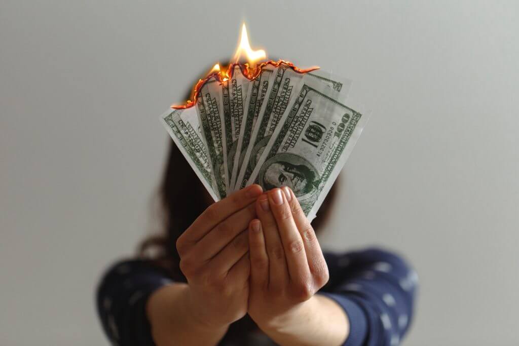 Burning money, as a representation of what inflation is